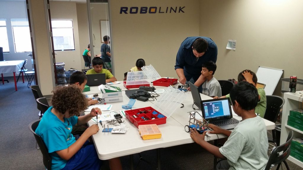 Children building with Rokit Smart in classroom